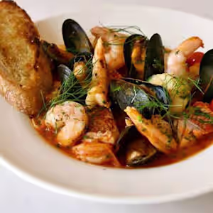 Casa Nostra Ristorante signature dishes Linguine Casa Nostra (with shrimp, clams, mussels, scallops)Veal ParmigianaGnocchi Quattro Formaggi